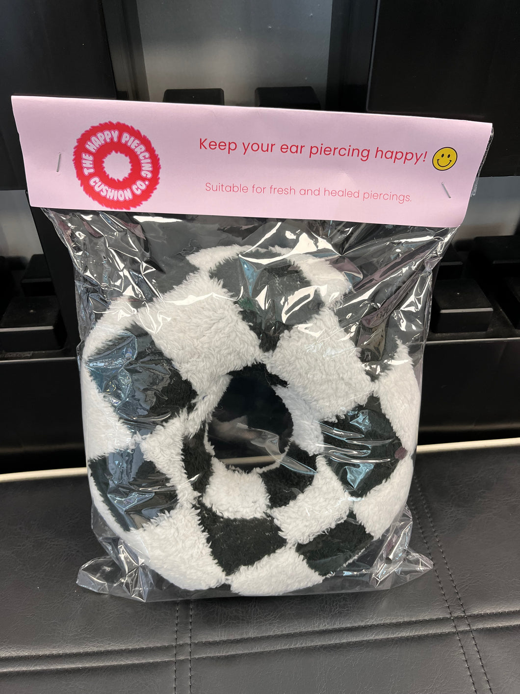 The Happy Piercing cushion